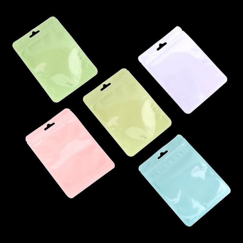 PET Ziplock BAG - Transparent FRONT WITH MIXED Colour Backing - Outside ±10.5×15 Cm - Inside ±9.5×12 Cm - Thickness 80 Micron
